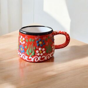 Handcrafted Red Ceramic Mug with Floral Design